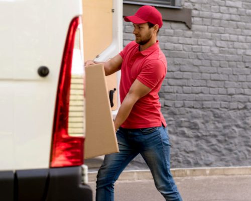 man-pushing-packages-car.jpg